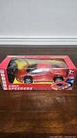 Red Siren Speeders remote control toy car in original packaging showing left side profile.