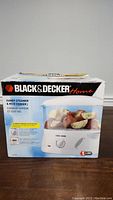 Photo of Black & Decker Handy Steamer & Rice Cooker box showing front with image of the product and branding.