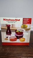 Photo of the KitchenAid Food Chopper and Prep Bowl Set box showing the product image and branding.