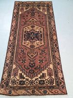 Full view of rug showing overall design, central medallion and border patterns