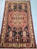 Full front view of rug showing overall geometric medallion design and border