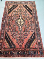 Full view of rug laid flat on floor, showing overall design, color and condition.