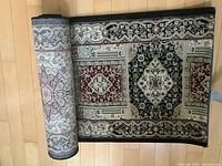 Full view of Opal carpet runner partially rolled, showing the pattern and color scheme