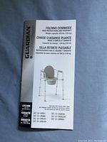 Instruction manual for Guardian folding commode with details on weight capacity, warranty, and multiple model numbers.