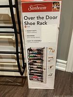 Photo of Sunbeam branded box showing over the door shoe rack details including capacity for 30 pairs, heavy duty metal, easy assembly with no tools required