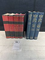 Both sets of books standing upright showing spines and titles clearly.