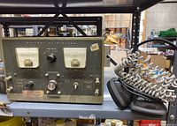 Wider photo of the HealthKit Battery Eliminator showing the overall device including side knobs.