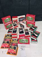 Overview of Hallmark Keepsake Ornaments and Coca-Cola Matchbox Premiere Collection items in original boxes and blister packs