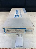 Box front showing Moen brand and model 7570W with Salora Glacier Lever label and pullout spout icon.