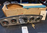 Vintage Ongaro marine instrument panel with gauges and original cardboard box, key, and instruction manual visible