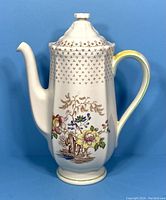 Front view of tall Royal Doulton coffee pot with floral Grantham pattern.