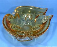 Top angled view of the vintage Chalet art glass ashtray showing amber edge details and organic flowing shape.