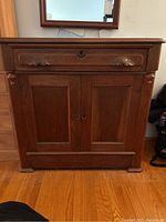 Front view of full cabinet showing drawer, doors, and overall condition