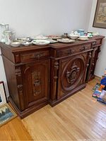 Front overview of buffet with tableware on top