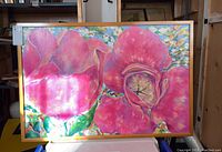 Full view of the framed original floral acrylic painting with large pink flowers, displayed hanging.