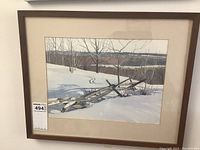 Frontal view of the framed watercolour painting showing the full artwork with snow, bare trees, and distant landscape in muted colors.