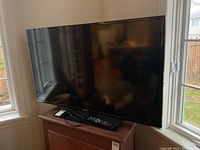 Front view of the television on stand