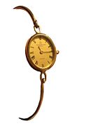 Side angle view of the Christian Bernard ladies watch showing the gold-tone oval face with Roman numerals and slender watch hands.