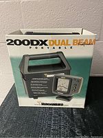 Box of Hummingbird 200DX Dual Beam Portable Fish Finder showing picture and branding.