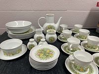 Full view of Noritake Bimini china collection showing plates, cups, saucers, coffee pot, creamer, sugar bowl, gravy boat, salt and pepper shakers.