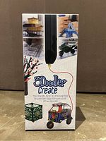 Front of the 3Doodler Create box showing the black pen and 3D objects made with the pen.