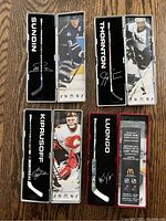 Four McDonald's NHL Star Sticks mini collectible hockey sticks each with a mini stick and player image in holder.