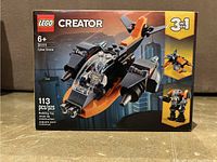 Front view of the Lego Creator 31111 Cyber Drone box showing brand, piece count, age recommendation, and main drone build.