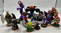 Shot showing all 11 Skylanders figures and accessories arranged in a single frame on white background.