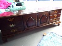 Full view of Lane wooden chest showing drawers, cabinet doors, hardware and surface wear