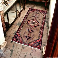 Runner laid out on tiled hallway floor showing placement and scale