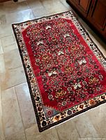 Full view of the Tafresh rug on floor showing complete pattern and colors.