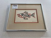 Framed artwork showing the full image with paper identification and frame