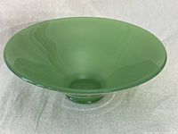Front view of the vintage jadeite green glass fruit bowl showing tapered shape and smooth glossy surface.