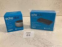 Photo showing both Echo Dot 3rd Gen and Echo Auto boxes unopened with MaxSold lot card