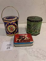 Photo of three metal tins showing lunch pail, green octagonal tin, and rectangular dog-themed tin.