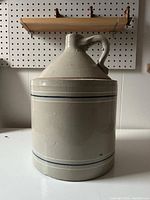 Front view of the jug showing the body, stripes, and handle, confirming size and decoration.