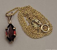 Coiled chain with pendant and clasp visible