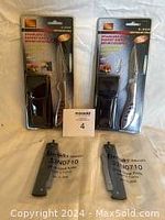 Two Lee Valley Douk-Douk folding knives unopened with model number 33N0710 and two John Benzen pocket cutting tools in original packaging and sheaths.