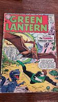 Full cover of Green Lantern comic No. 30 showing artwork with prehistoric theme and Green Lantern character in action.