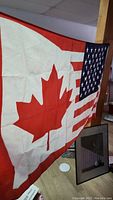 Photo showing the full Snowbird flag with Canadian maple leaf and US stars and stripes design.