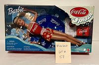Full boxed view of sealed 1999 Coca Cola Splash Barbie doll with float and cooler visible.