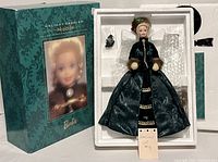 Porcelain Barbie doll in original box with accessories sealed in plastic.