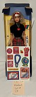 1995 Special Edition School Spirit Barbie doll standing in original inner packaging (box not included), dressed in black top and plaid red skirt with a headband and necklace. Doll is new and unused.