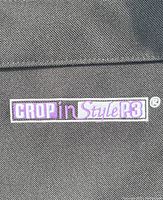 Close-up photo of Crop In Style P3 logo patch on the exterior of the black caddy