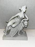 Front and side view of the statue showing Ariadne seated on the panther with visible facial and fabric details.