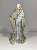 Front view of Lenox Rapunzel porcelain figurine showing detailed face, gown, and hair.