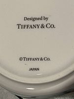 Close-up photo of the bottom of the bowl showing 'Designed by Tiffany & Co.' mark and 'Japan' stamp.
