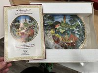 Collector plate "A Tribute to Love" with certificate showing detailed artwork and gold rim in original packaging.