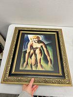 Front view of the framed cubist art print showing the gold ornate frame and the cubist figure kneeling in geometric shapes.