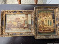 Pair of two framed Continental Oilette paintings on black surface, showing ornate gold Art Nouveau frames and aged paint details